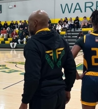 example of man wearing merch at basketball game