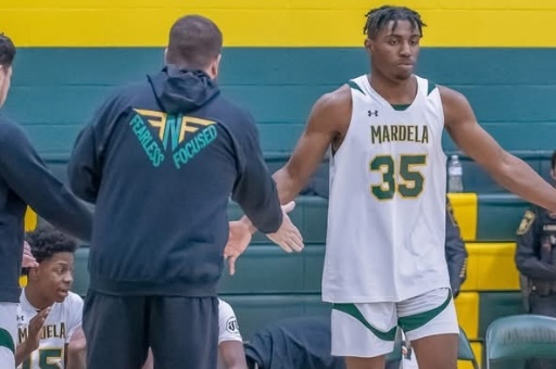 example of man wearing merch at basketball game